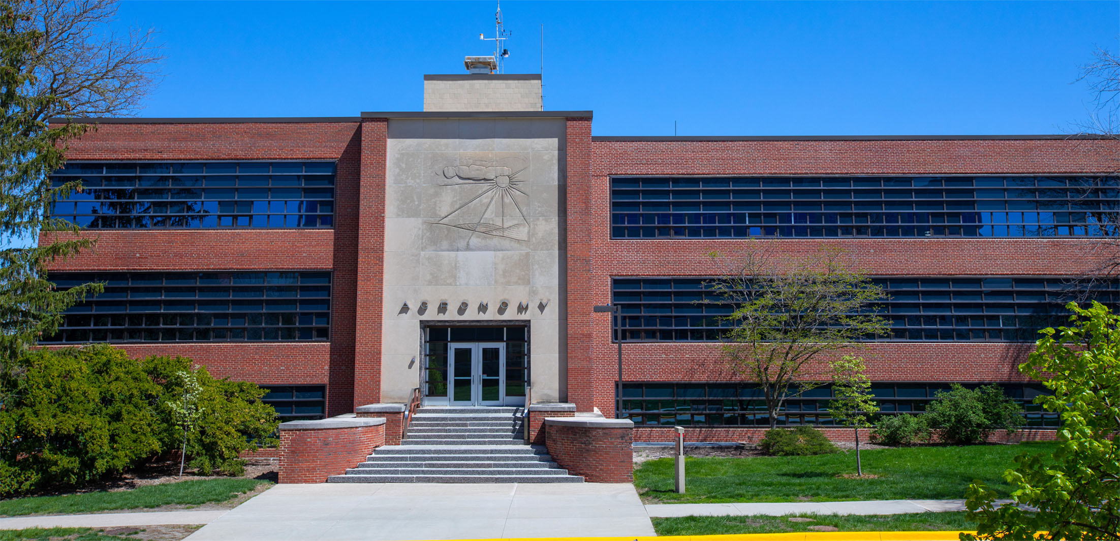 Agronomy Hall against blue skies at Iowa State University.